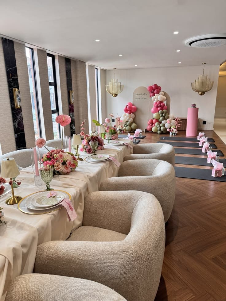 The Pre-Launch gathering venue, set up with florals and yoga mats